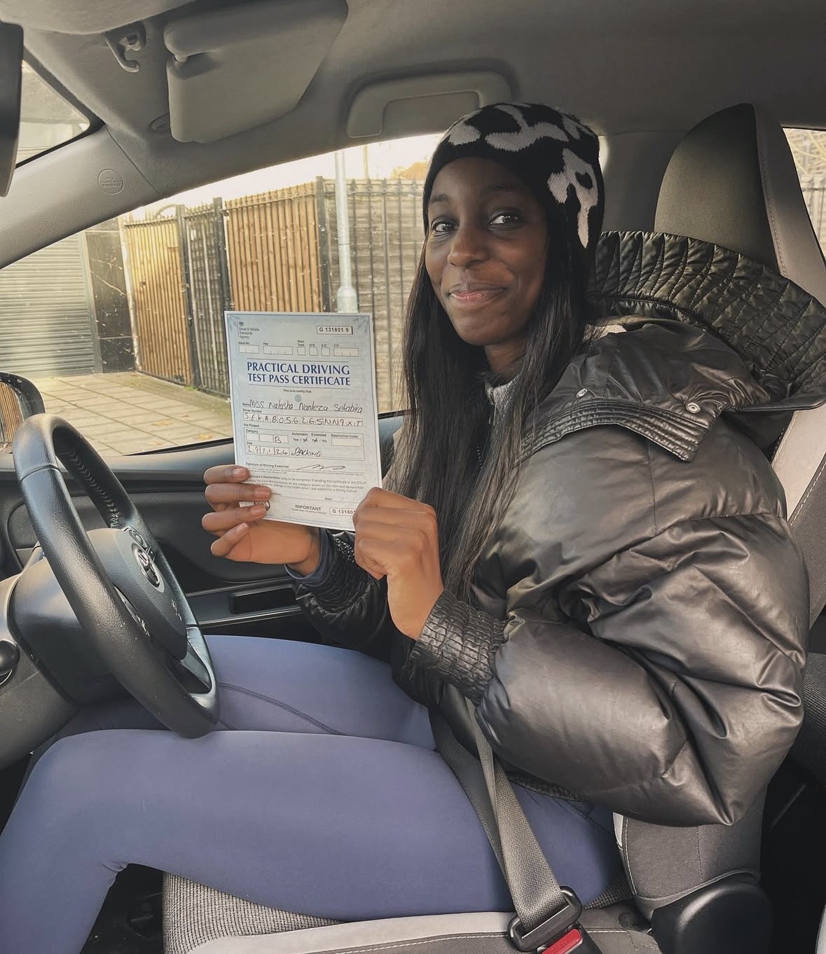 Learner celebrating passing their driving test